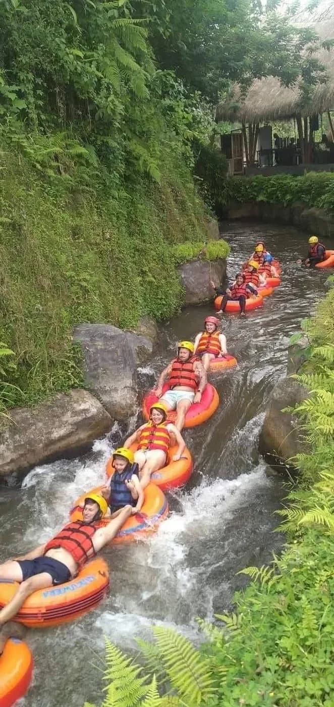 Rafts running a green river gorge in Bali